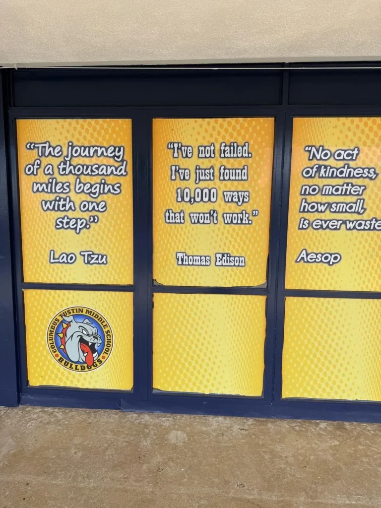 Inspirational quote display at Columbus Tustin Middle School during a community event